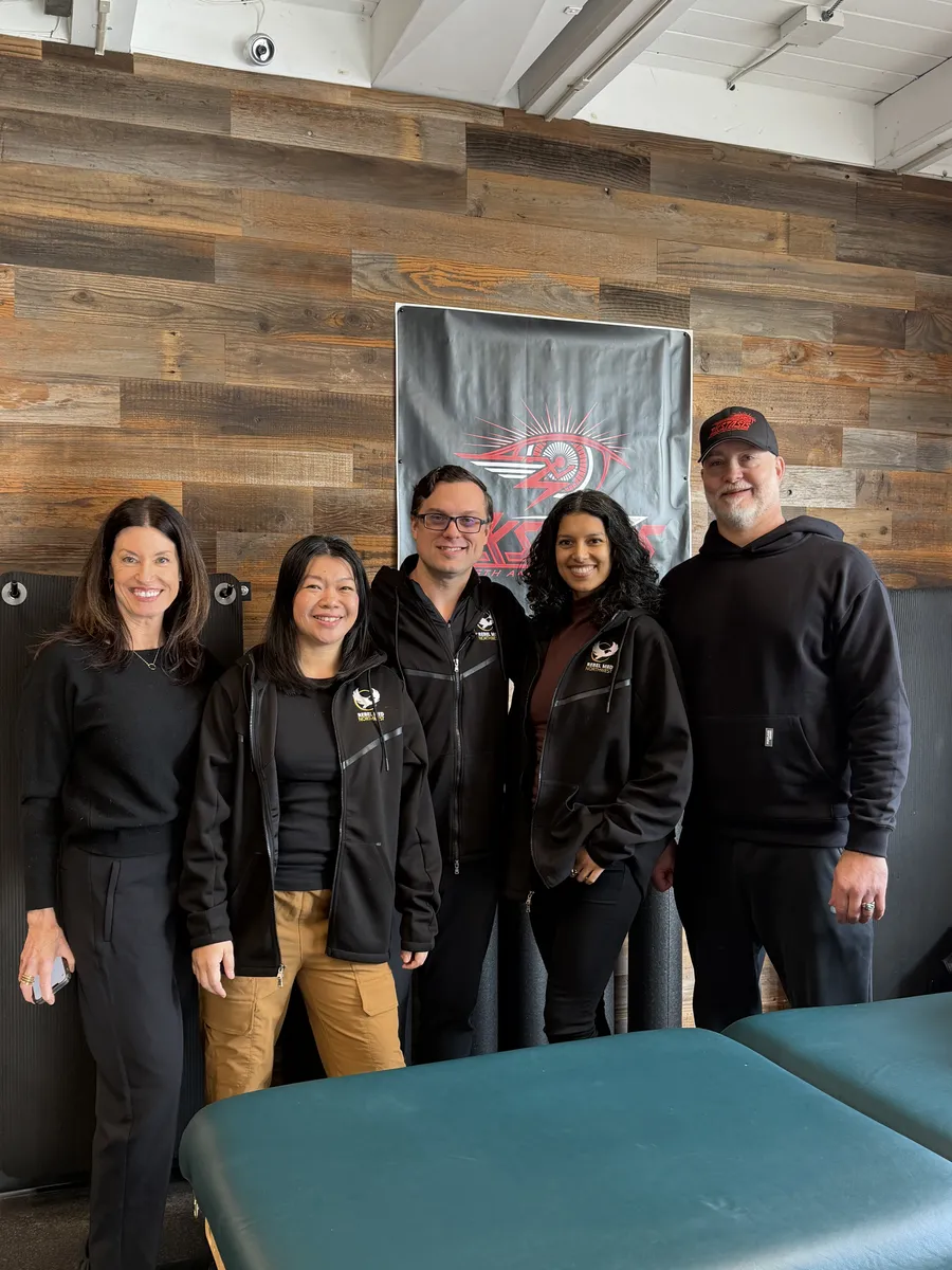 Dr. Andrew Simon with staff after a body-composition presentation at a local Seattle gym